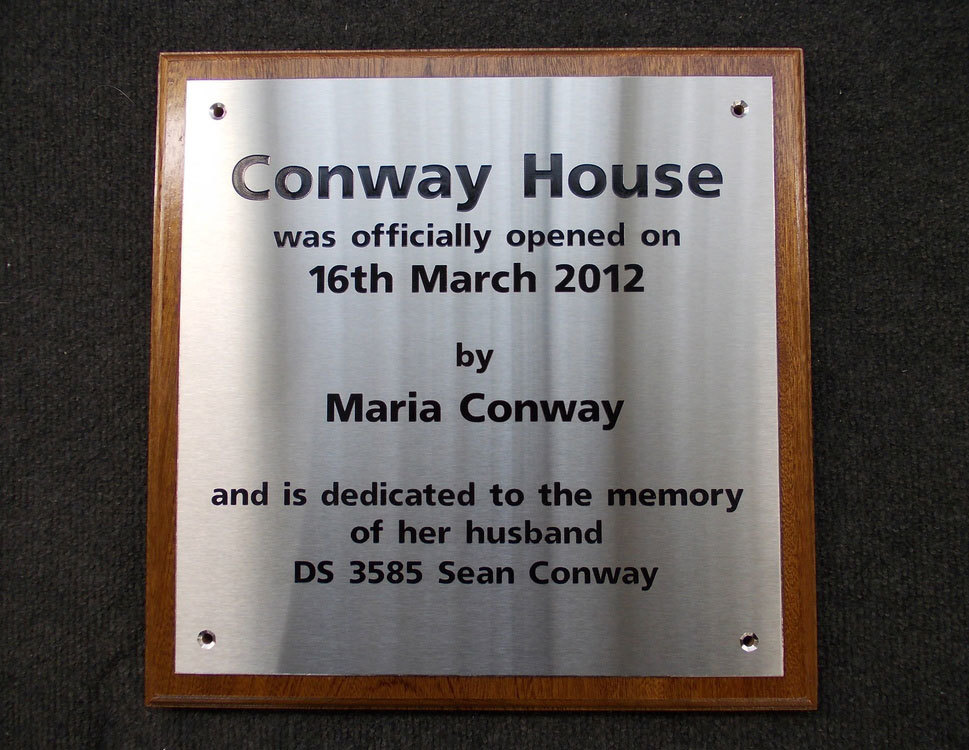 stainless steel plaque on wooden